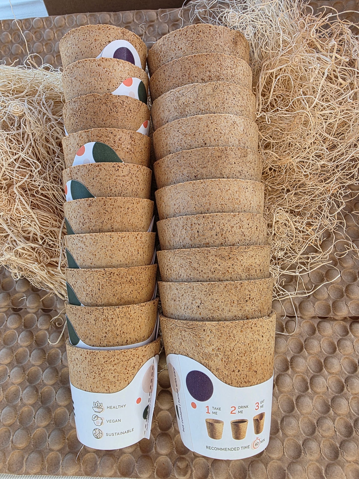 Rolls of cork material with a label on a textured surface